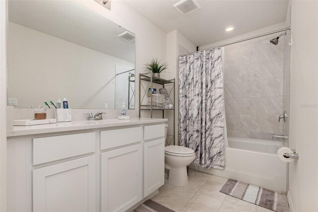 2623 Buena View Rd, Kissimmee, FL 34746 - bathroom featuring toilet, vanity, shower / tub combo with curtain, tile patterned floors, and recessed lighting