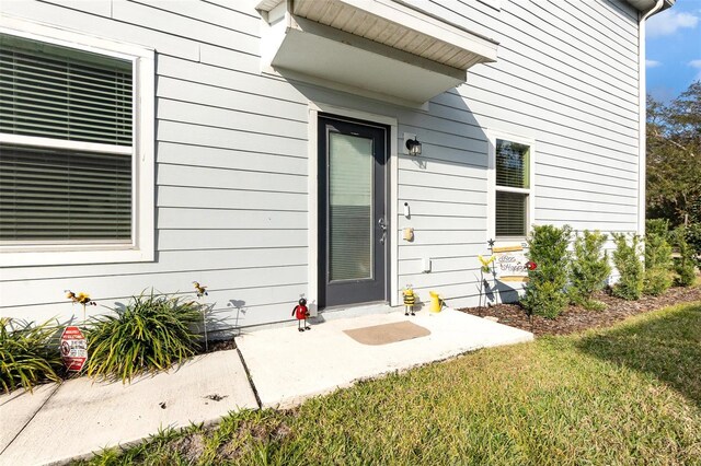 2623 Buena View Rd, Kissimmee, FL 34746 - doorway to property featuring a lawn