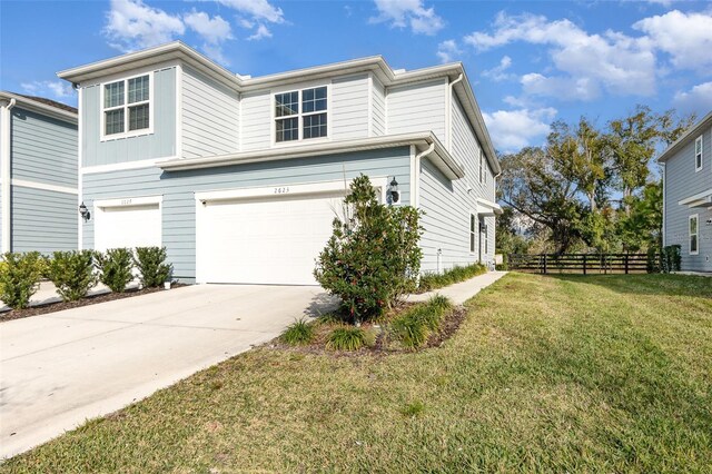 2623 Buena View Rd, Kissimmee, FL 34746 - view of side of property featuring a garage and concrete driveway