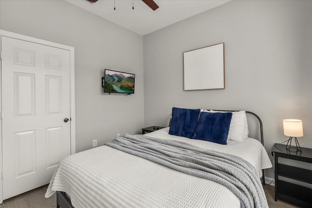 bedroom with a ceiling fan and wood finished floors