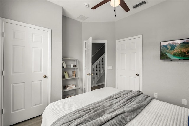 bedroom featuring ceiling fan, light wood-type flooring, and visible vents