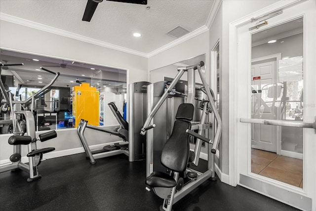 exercise room featuring visible vents, a ceiling fan, a textured ceiling, and ornamental molding