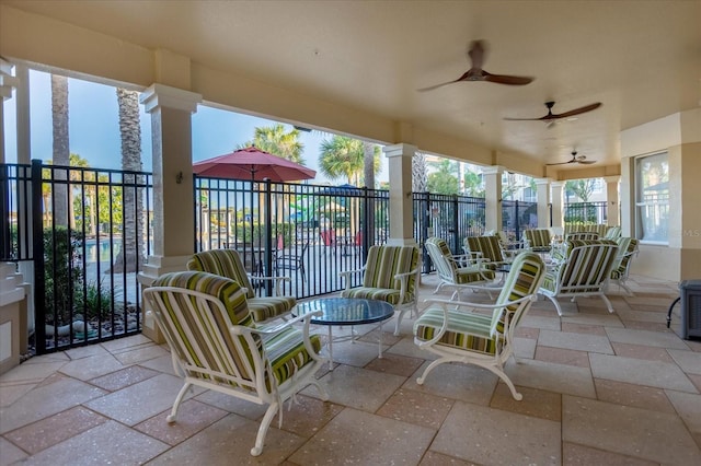 exterior space featuring fence and ceiling fan