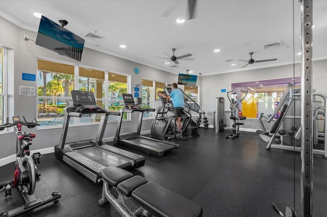 workout area with baseboards, recessed lighting, visible vents, and crown molding