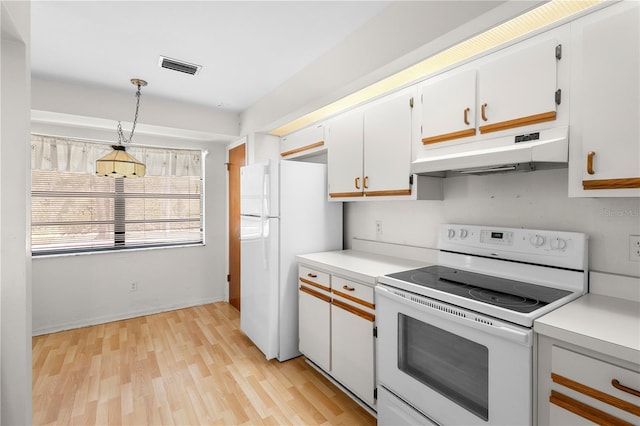 kitchen with hanging light fixtures, white cabinets, white appliances, and light hardwood / wood-style floors