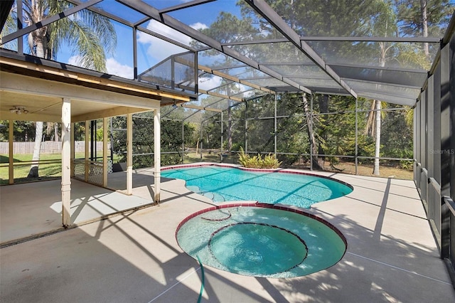 view of pool featuring a lanai, a patio, and an in ground hot tub