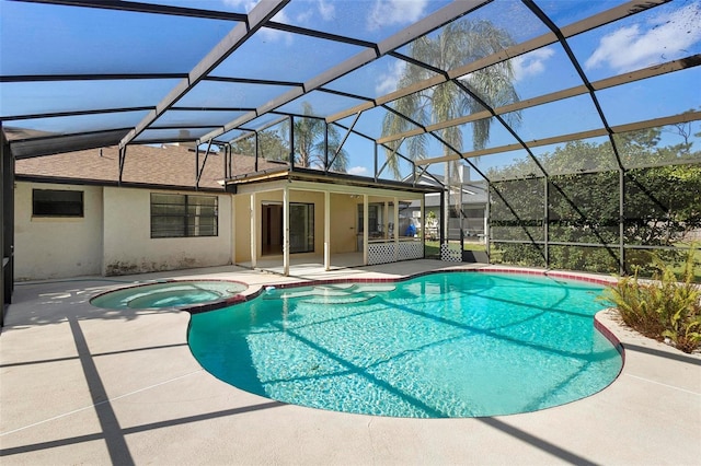 view of swimming pool with an in ground hot tub, a lanai, and a patio