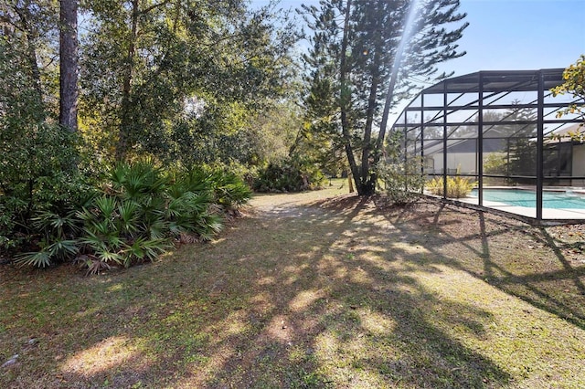 view of yard with a lanai