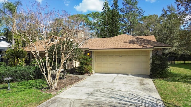 view of front facade with a garage and a front yard