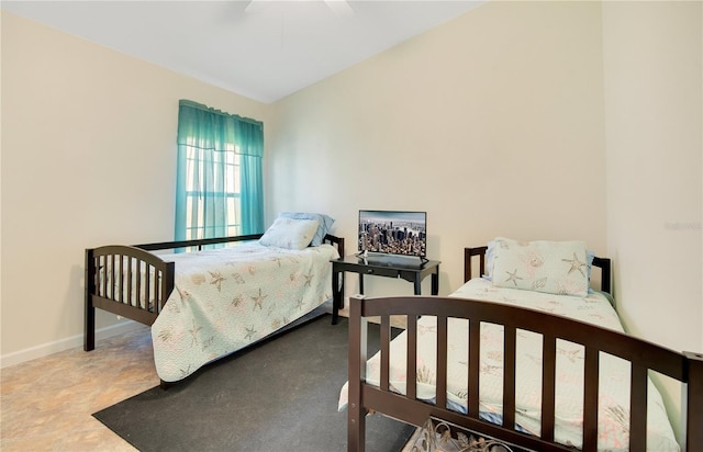 bedroom featuring vaulted ceiling and ceiling fan