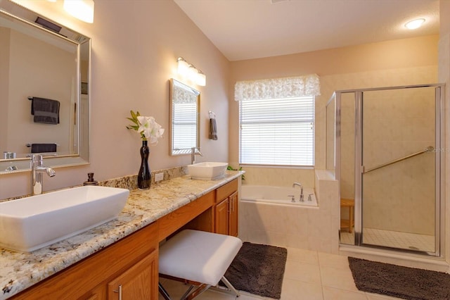 bathroom with vanity, independent shower and bath, and tile patterned flooring