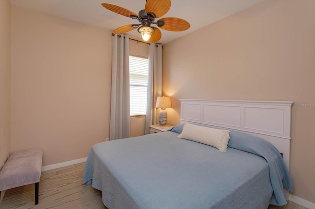 bedroom featuring light hardwood / wood-style flooring and ceiling fan