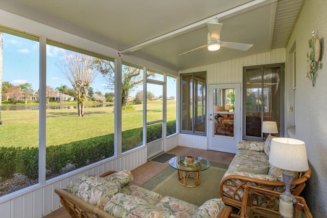 sunroom / solarium featuring ceiling fan