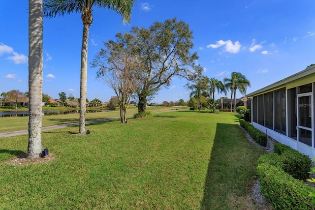 view of yard featuring a sunroom