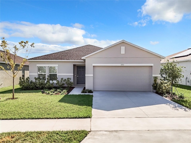 ranch-style house featuring a garage and a front lawn