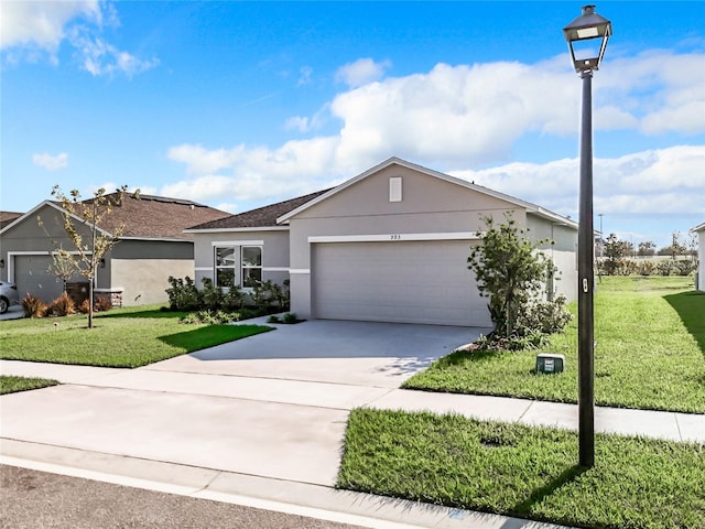 ranch-style house with a garage and a front lawn