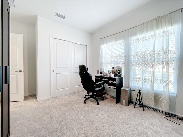 office space with light colored carpet