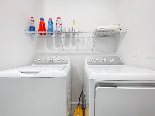 washroom featuring washer and dryer