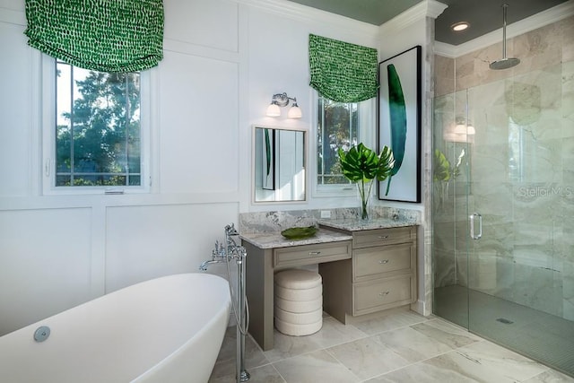 bathroom with vanity, crown molding, and independent shower and bath