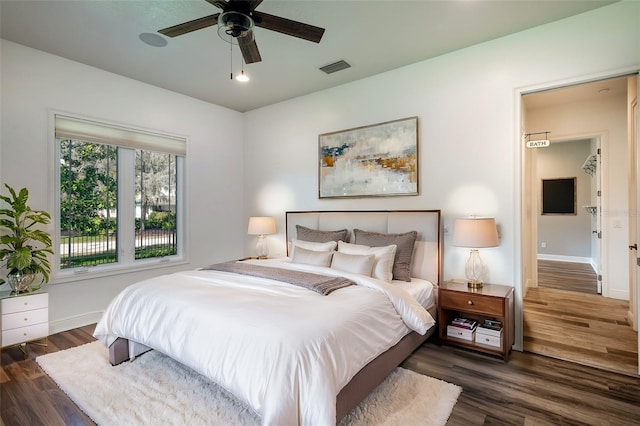 bedroom featuring dark hardwood / wood-style floors and ceiling fan