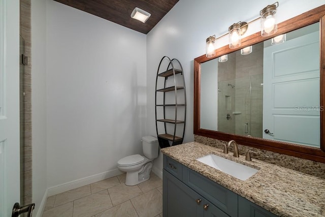 bathroom featuring walk in shower, vanity, toilet, and tile patterned flooring