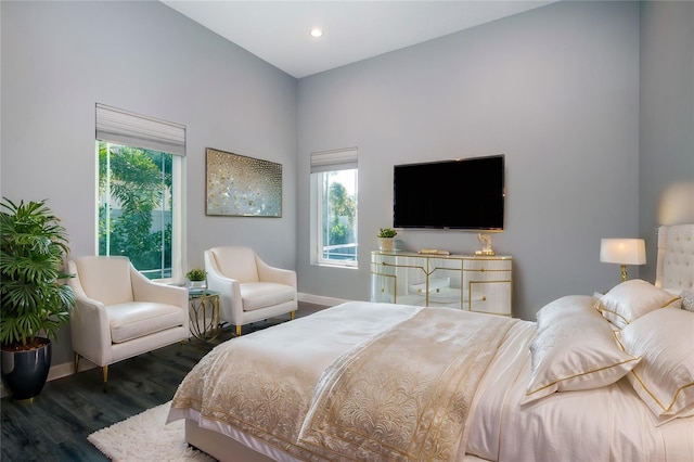 bedroom with dark wood-type flooring