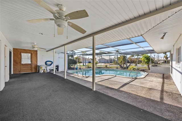 view of pool featuring ceiling fan, a lanai, and a patio area