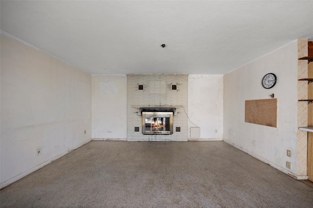 unfurnished living room with a textured ceiling and a fireplace