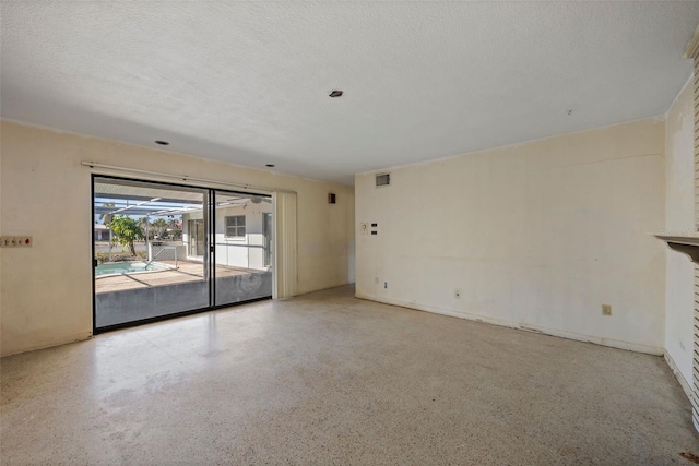 empty room featuring a textured ceiling