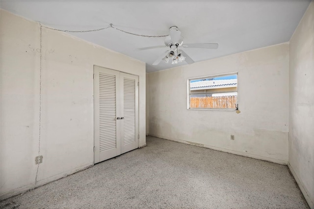 unfurnished bedroom with a closet and ceiling fan