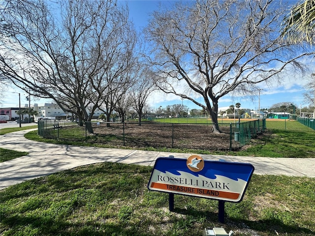 view of property's community with a yard