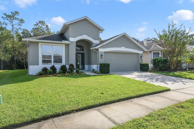 ranch-style house with a garage and a front yard