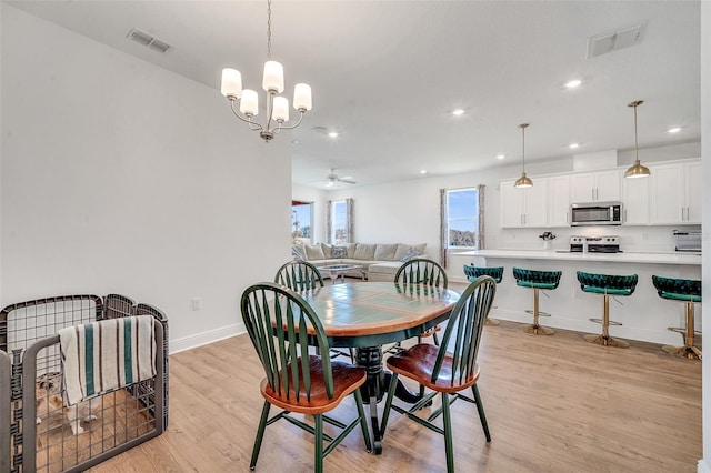 dining room featuring light hardwood / wood-style floors and ceiling fan