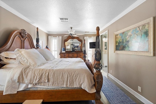 bedroom featuring wood-type flooring, ornamental molding, ceiling fan, and a textured ceiling