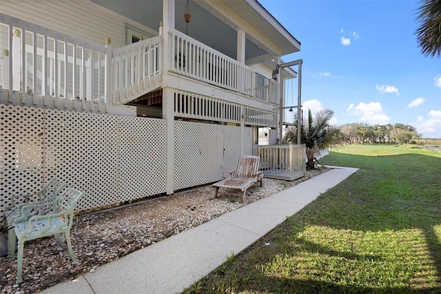 view of side of property with a yard