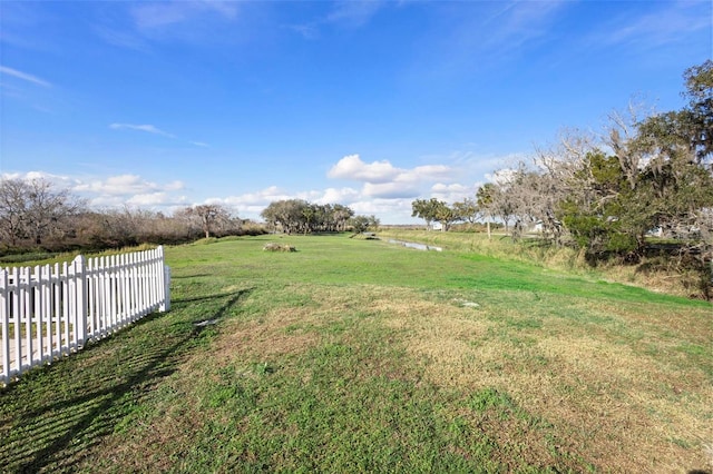 view of yard with a rural view