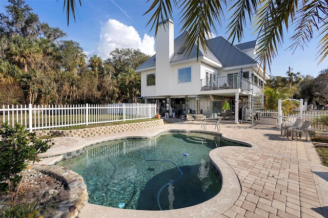 view of swimming pool featuring a patio