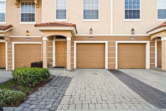 view of front of property with a garage