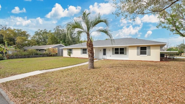 single story home with a front yard