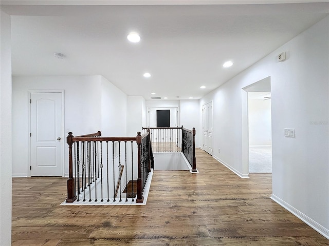 corridor featuring dark wood-type flooring