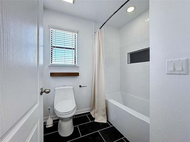 bathroom featuring tile patterned flooring, toilet, a textured ceiling, and shower / bath combo with shower curtain