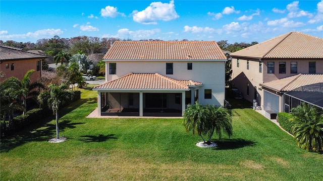 back of property featuring a lawn and a sunroom