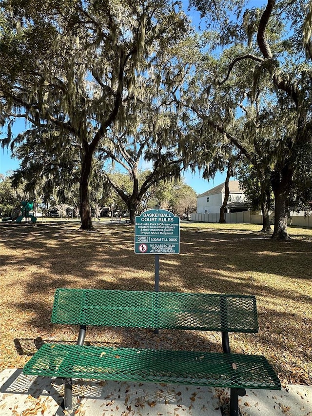 view of community with a yard and a playground