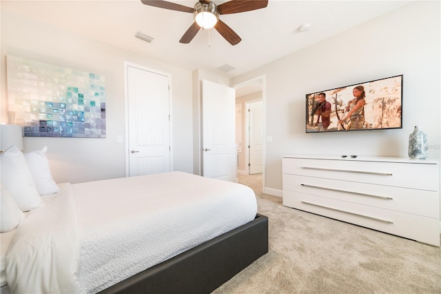 carpeted bedroom with ceiling fan