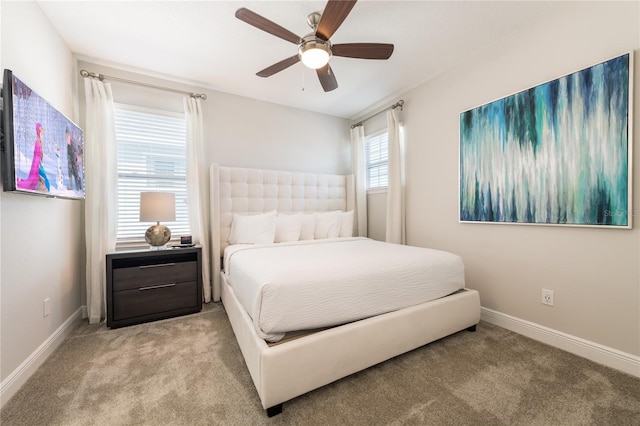 bedroom featuring light carpet and ceiling fan