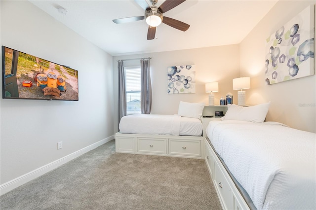 bedroom featuring light colored carpet and ceiling fan