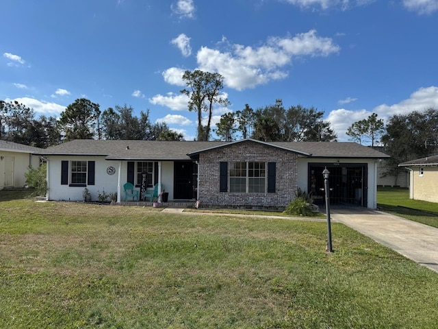 single story home featuring a garage and a front lawn