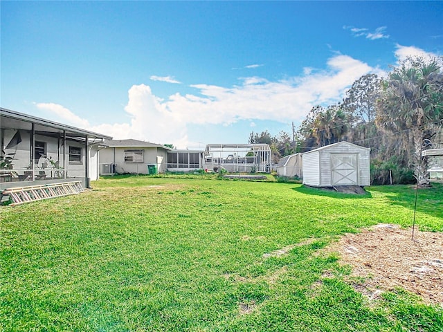 view of yard with a storage unit