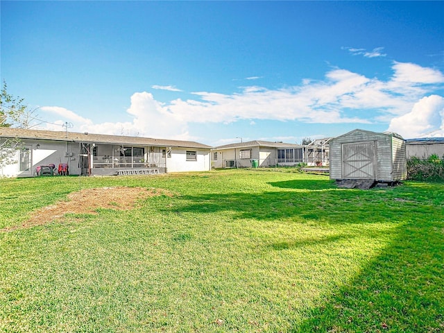 view of yard with a storage unit