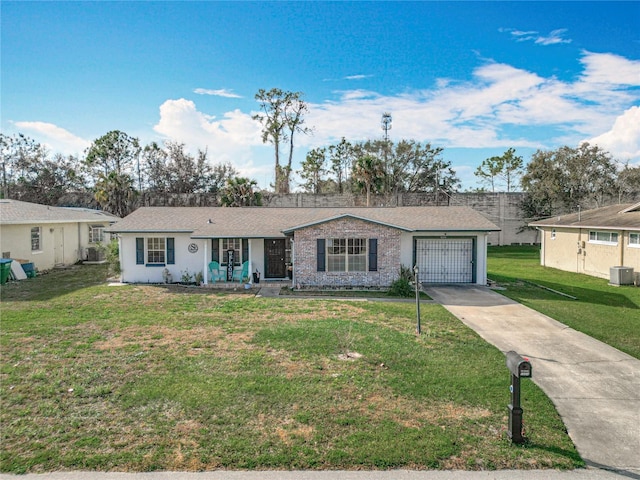 ranch-style house with a garage, a front yard, and central air condition unit